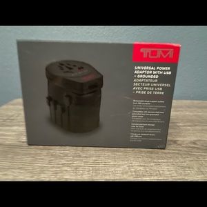 TUMI Universal adapter with case.